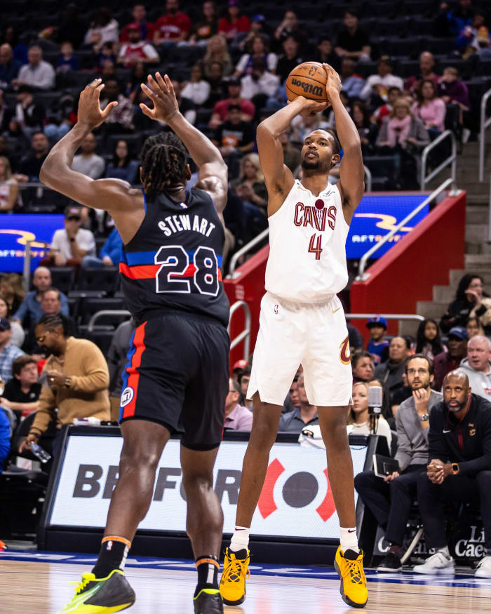 Nov 4, 2022; Detroit, Michigan, USA; Cleveland Cavaliers forward Evan Mobley (4) shoots a 3-pointer against Detroit Pistons center Isaiah Stewart (28) in the first quarter at Little Caesars Arena.